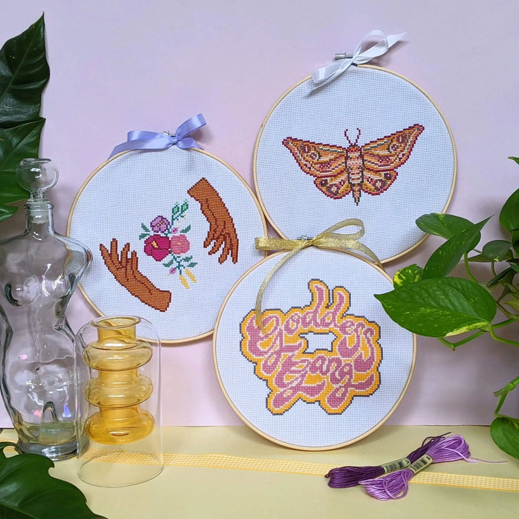 Cross Club Co POSSÉ Cross Stitch Kit Bundle includes the Craft Club MOTH Cross Stitch Kit, Craft Club GODDESS GANG Cross Stitch Kit and Craft Club HANDS HOLD Cross Stitch kit. Each design is bold, unique and funky, bringing loads of personality to the space.