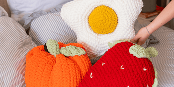 close up of pumpkin, daisy, and strawberry chunky crochet