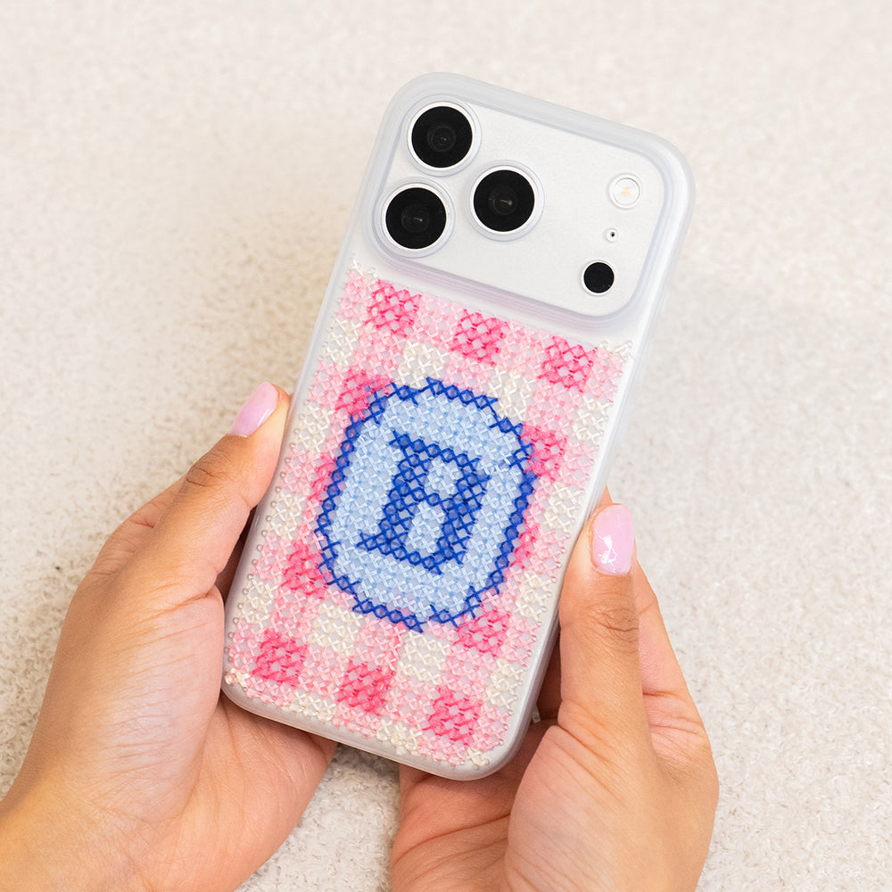 Craft Club Preppy Pink Personalised Initials Cross Stitch Phone Case Kit — finished case held in hands
