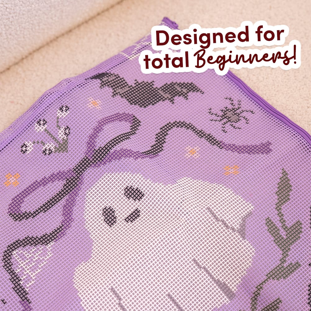 Close-up of the pre-printed BOO-TIFUL canvas showing the ghost, bats and bow before stitching