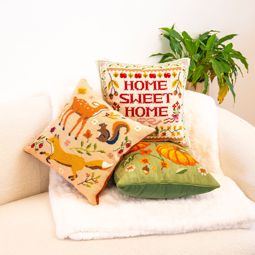 FALL FRIENDS grouped with the HOME SWEET HOME and COTTAGE PUMPKINS needlepoint cushions