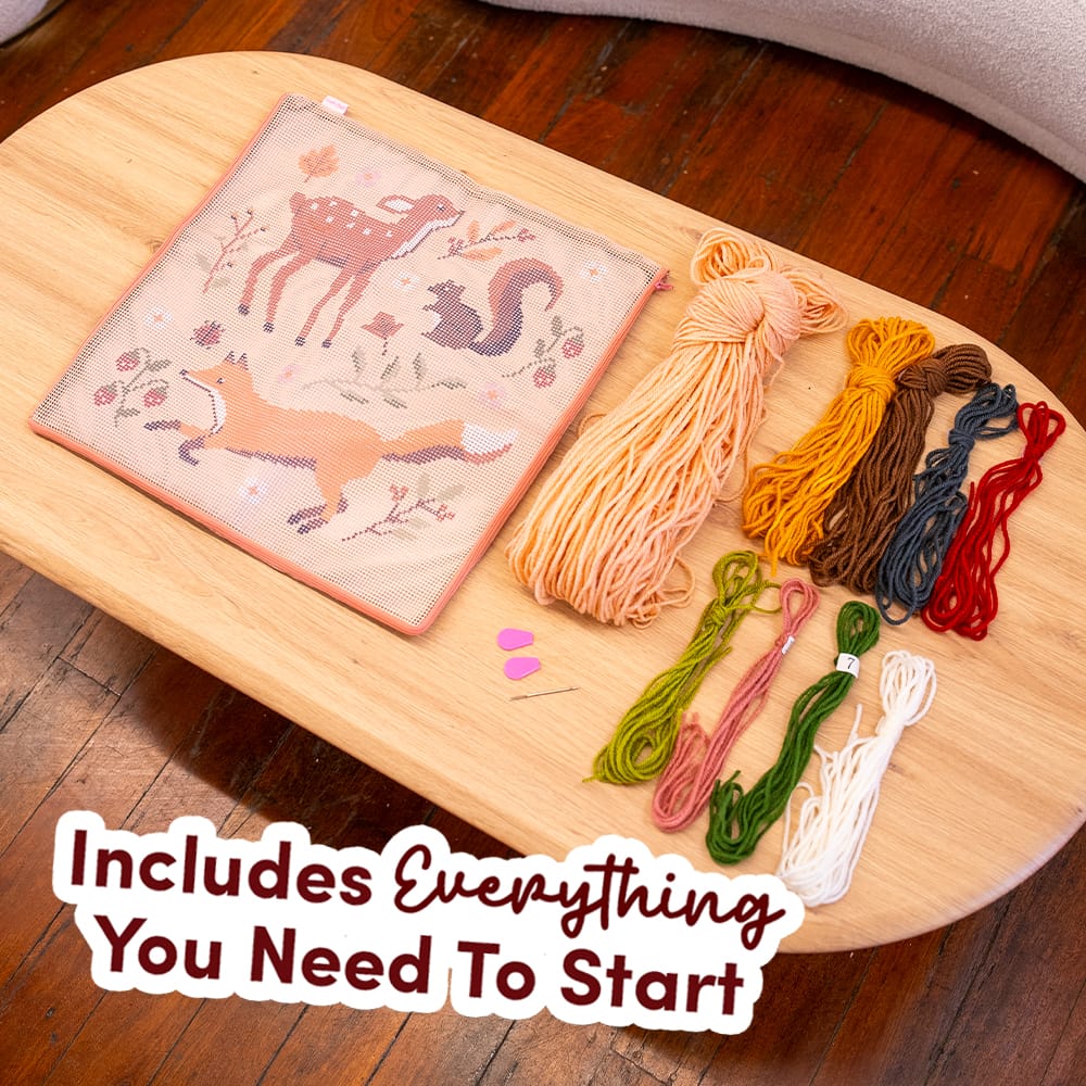 Everything in the FALL FRIENDS kit: printed canvas, tan, mustard, green, red and cream yarn, needle threader
