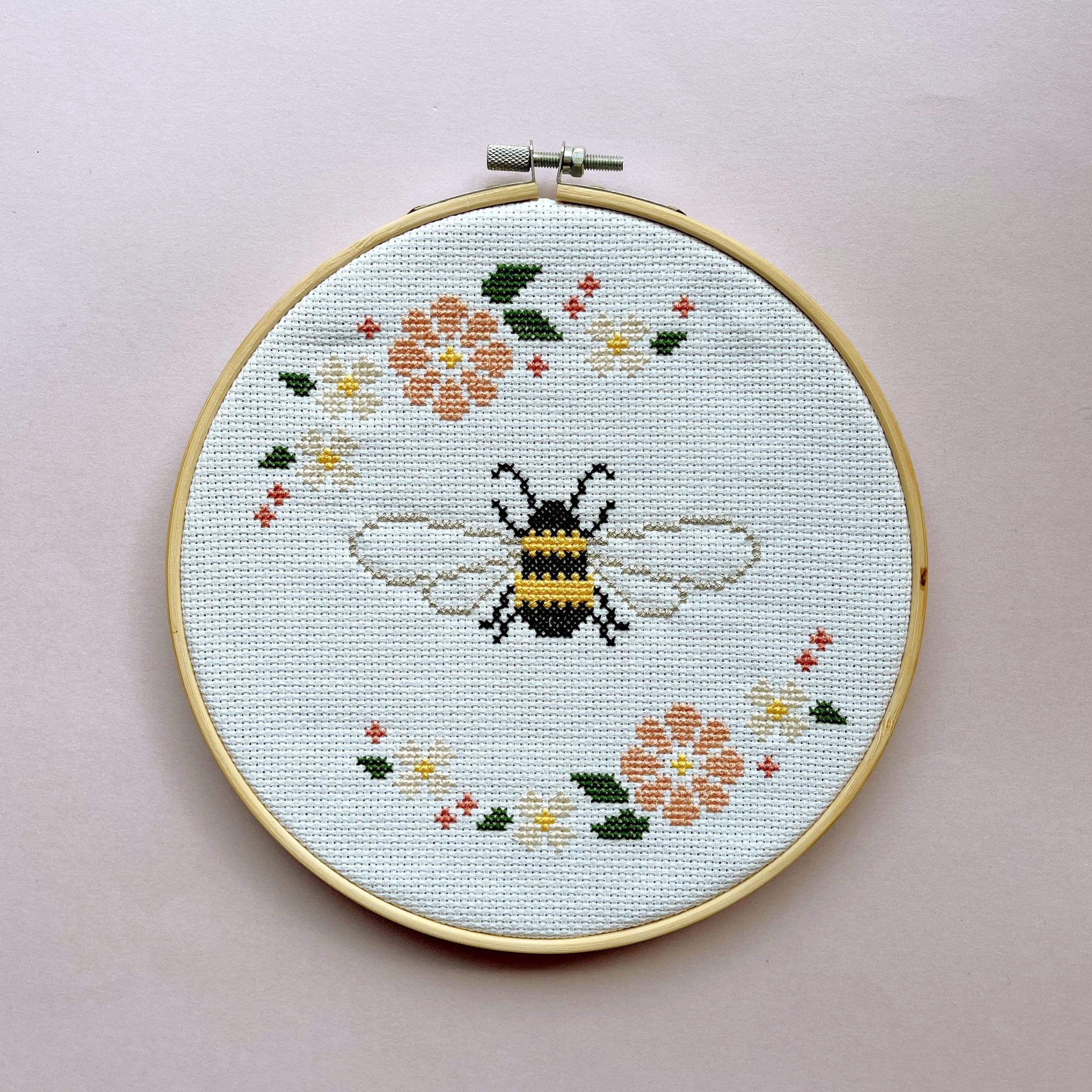Craft Club Co BEE & BLOSSOM Cross Stitch Kit. The design with a plain light pink background.