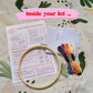 Craft Club Co GODDESS GANG Cross Stitch Kit. Showing what is inside your kit, a bamboo hoop, instructions, aida fabric, full packs of thread and a needle.