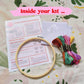 Craft Club Co HANDS HOLD Cross Stitch Kit. Showing what is inside the kit, a bamboo hoop, instructions, aida fabric, full packs of thread and a needle.
