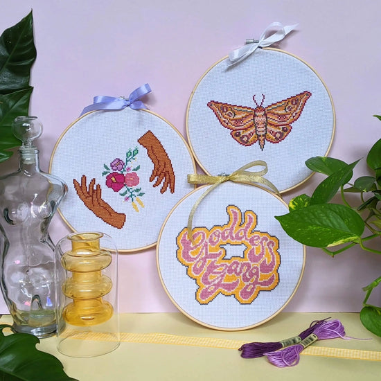 Cross Club Co POSSÉ Cross Stitch Kit Bundle includes the Craft Club MOTH Cross Stitch Kit, Craft Club GODDESS GANG Cross Stitch Kit and Craft Club HANDS HOLD Cross Stitch kit. Each design is bold, unique and funky, bringing loads of personality to the space.