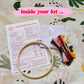 Craft Club Co MOTH Cross Stitch Kit. Showing what is inside the kit, a bamboo hoop, instructions, aida fabric, full packs of thread and a needle.